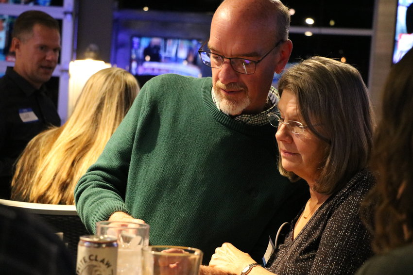 School board president and incumbent David Ray and his wife look at the latest round of election results Tuesday, Nov. 5.